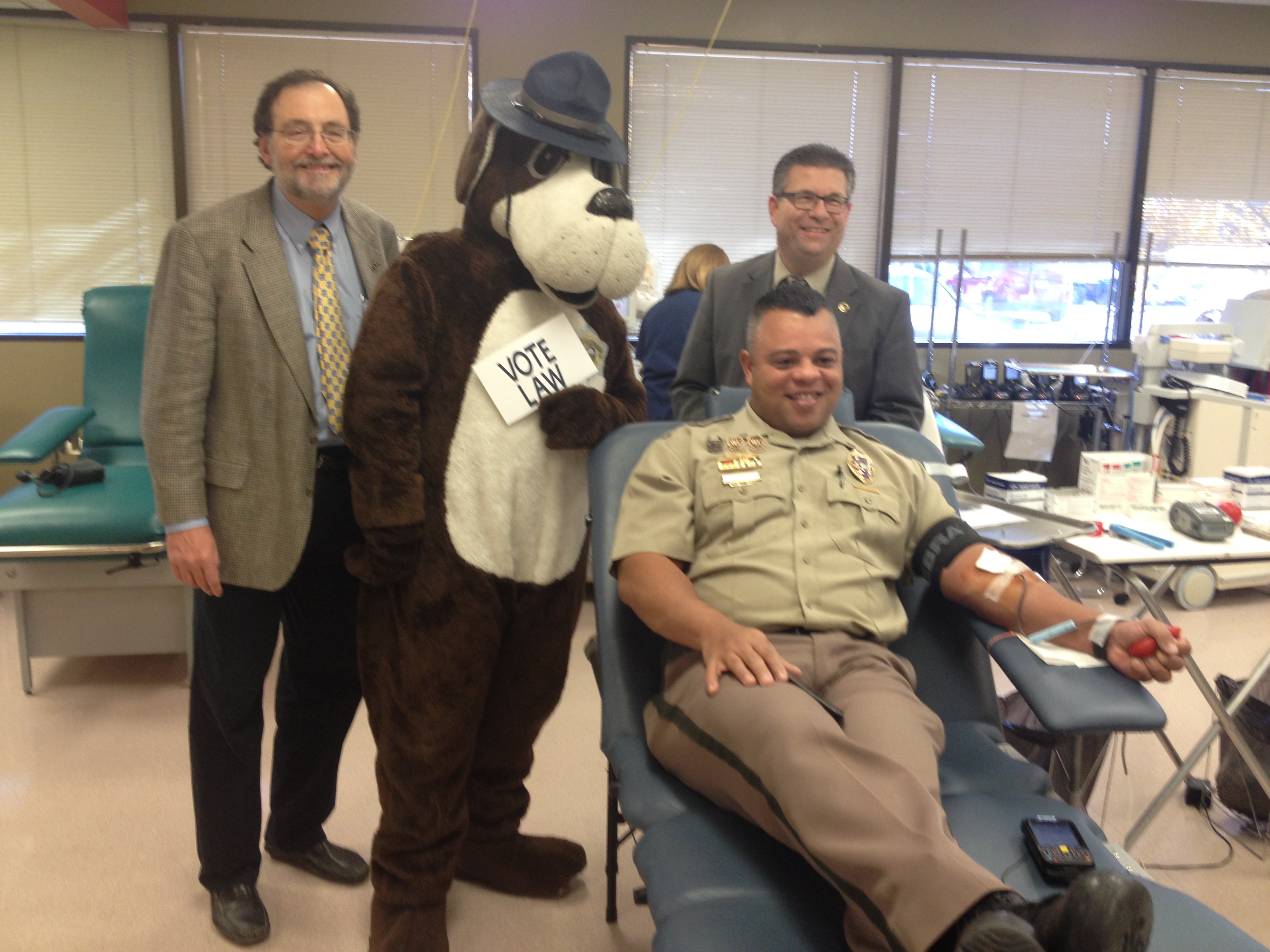 commissioners with blood donor
