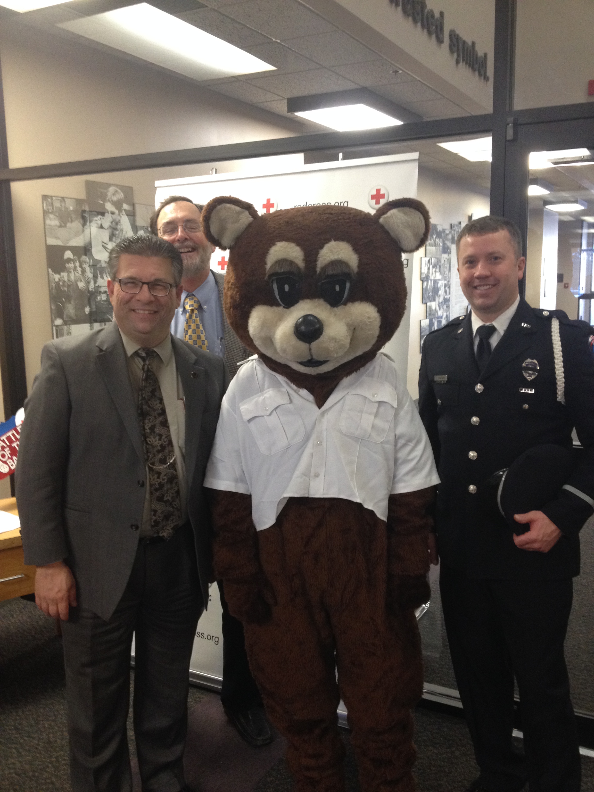commissioners with law enforcement mascot