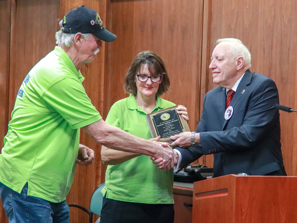 Chairman Dennis shaking hands with representatives from Kansas Honor Flight.