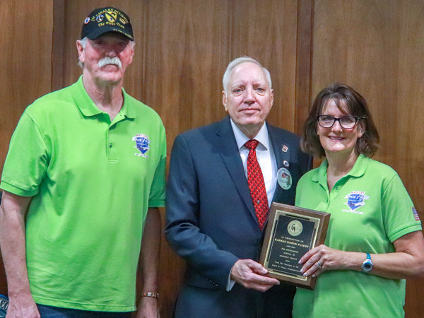 Representatives of Kansas Honor Flight posing with Chairman Dennis.