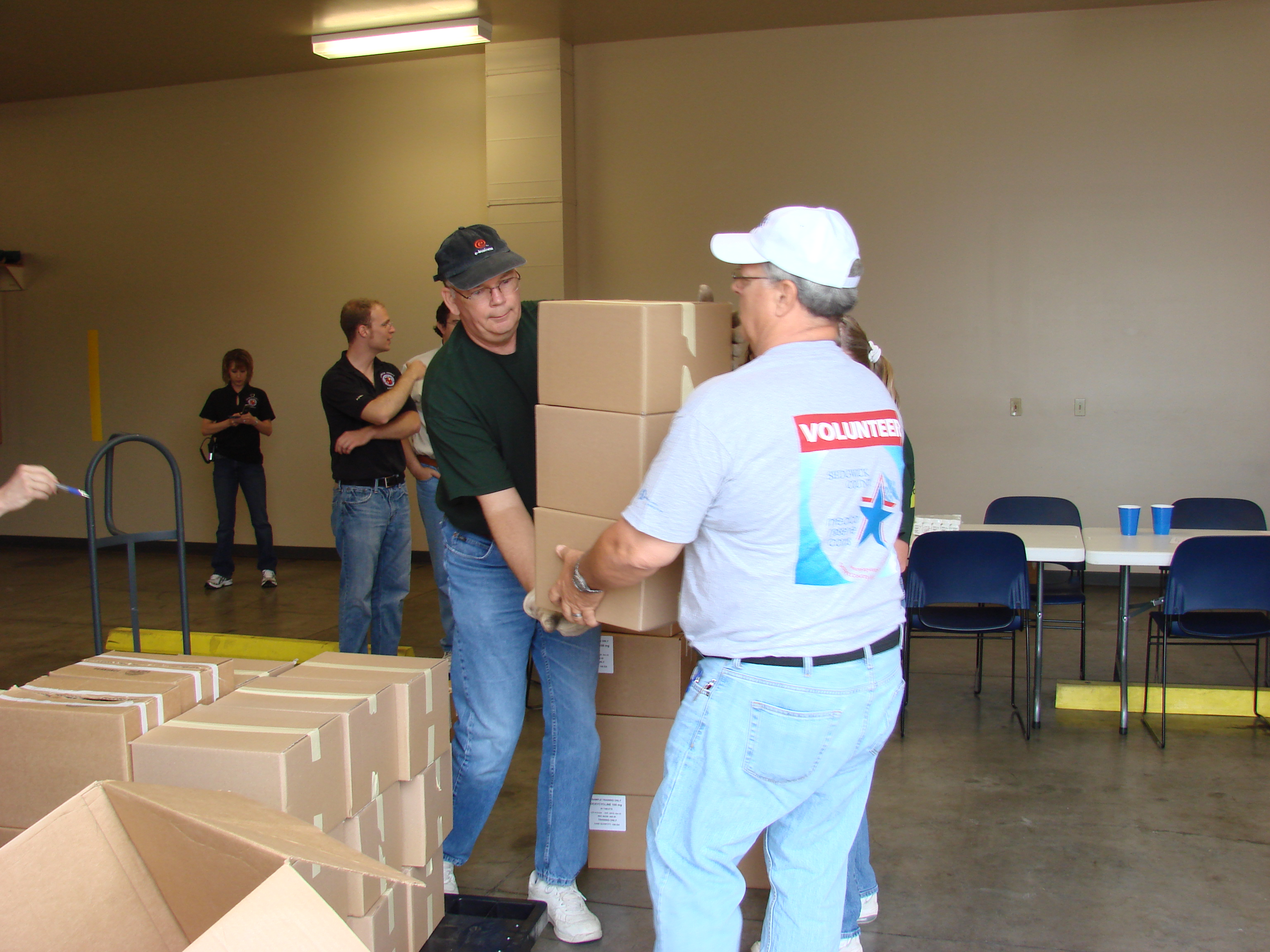 Volunteers moving boxes