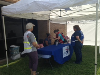 Volunteers at check in desk