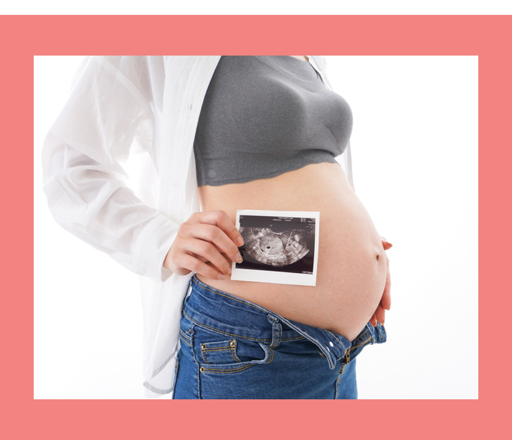 pregnant woman's belly with sonogram picture